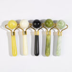 Image représentant 5 rouleaux de jade massants de différentes couleurs