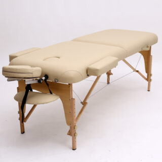 Table de massage blanche avec des pieds en bois