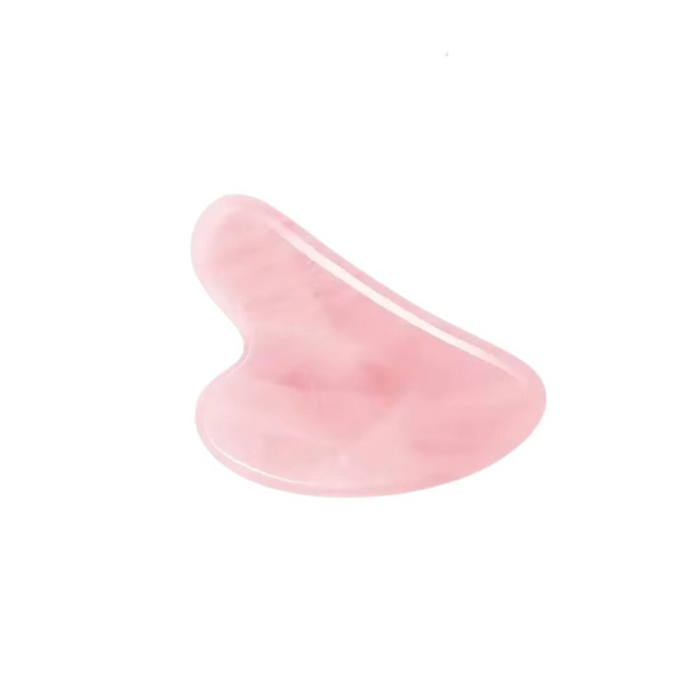 Pierre de massage visage rose en résine sur fond blanc